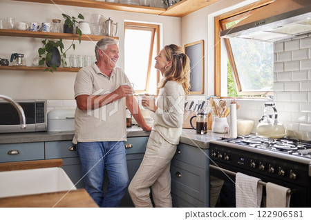 Mature couple, bonding or morning coffee in kitchen of relax home or retirement house. Smile, happy or talking senior man and woman laughing with tea in trust communication, security or love marriage Mature couple, bonding or morning coffee in kitchen of relax home or retirement house. Smile, happy or talking senior man and woman laughing with tea in trust communication, security or love marriage 122906581