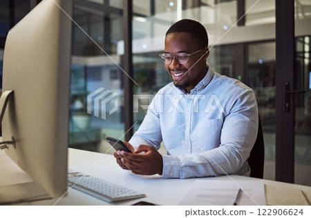 Social media phone, night work and businessman reading an email on smartphone while working in a dark office at night. Corporate African manager in communication on mobile app while doing overtime Social media phone, night work and businessman reading an email on smartphone while working in a dark office at night. Corporate African manager in communication on mobile app while doing overtime 122906624