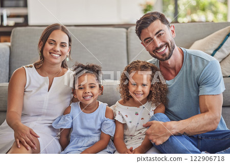 Portrait, happy family in home living room and smile bonding together by sofa. Love, relax and caring parents or dad, mom and girls from Spain spending quality time, care and support in house lounge 122906718