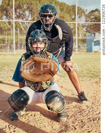 Baseball, sport and training with a sports man or catcher on a field for fitness and exercise outdoor during summer. Workout, health and focus with a male player ready to catch during a game or match 122906726