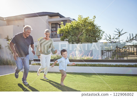 Family running, happy garden and child happy on grass with grandparents, smile for exercise in backyard and fitness together in nature. Grandmother and man playing with kid in park by house in summer Family running, happy garden and child happy on grass with grandparents, smile for exercise in backyard and fitness together in nature. Grandmother and man playing with kid in park by house in summer 122906802