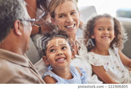 Happy, smile and family relax on living room couch and talking, conversation and doing a catch up. Love, diverse grandparents and grandchildren bonding, fun and quality time in family home together. 122906805