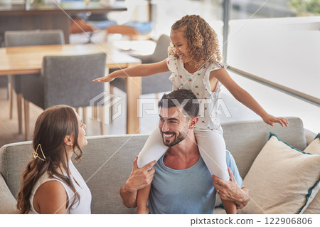 Children, family and love with a girl, mother and father playing on a sofa in the living room of their home together. Kids, happy and smile with a man, woman and daughter having fun in their house Children, family and love with a girl, mother and father playing on a sofa in the living room of their home together. Kids, happy and smile with a man, woman and daughter having fun in their house 122906806