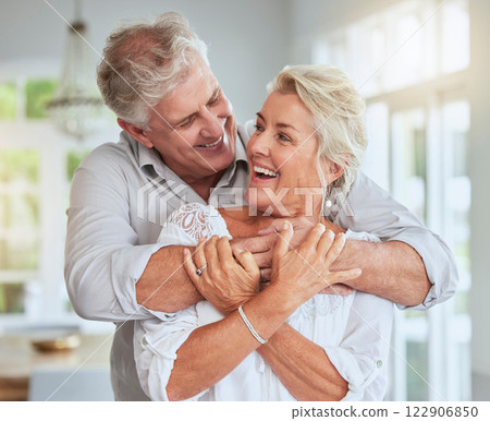 Senior couple, happy and hug for love, support and care in relationship at home embrace, bond or smile. Romance, married or retired old elderly man and woman in retirement celebrate marriage together 122906850