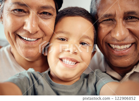 Boy take selfie with happy grandparents, together in closeup or zoom portrait in house. Latino male child smile with grandma and grandpa in macro with expression of happiness and love in family home Boy take selfie with happy grandparents, together in closeup or zoom portrait in house. Latino male child smile with grandma and grandpa in macro with expression of happiness and love in family home 122906852