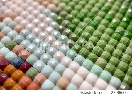 Close-up, colorful round diamond embroidery bright. Hobbies and entertainment. Close-up, colorful round diamond embroidery bright. Hobbies and entertainment. 122906884