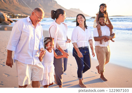 Big family, children and beach vacation with parents and grandparents enjoying summer travel on fun on tropical trip. Walking, bonding and happy men, women and girl kids on South Africa holiday 122907103