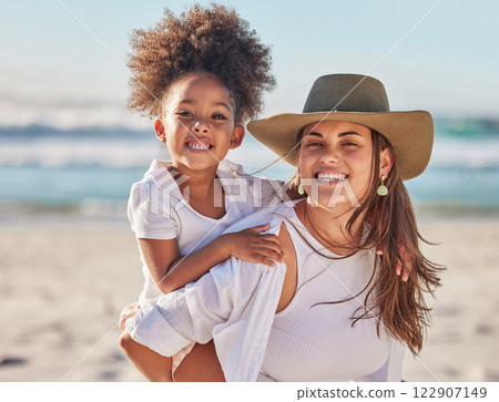 Mom, girl and beach bonding in carrying game by sea or ocean in Mexico for summer family holiday. Portrait, smile or happy woman, mother or parent with afro child, kid or daughter in nature landscape Mom, girl and beach bonding in carrying game by sea or ocean in Mexico for summer family holiday. Portrait, smile or happy woman, mother or parent with afro child, kid or daughter in nature landscape 122907149