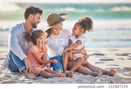 Interracial family, beach vacation and travel with children and parents sitting in sand enjoying summer holiday in maldives. Man, woman and girl kids having fun and feeling happy on a tropical trip Interracial family, beach vacation and travel with children and parents sitting in sand enjoying summer holiday in maldives. Man, woman and girl kids having fun and feeling happy on a tropical trip 122907154