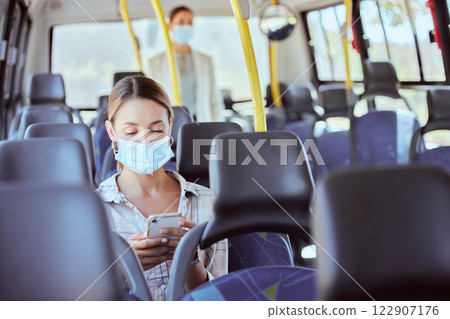 Covid, travel and phone social media with mask for illness prevention on public bus trip. Safety protocol girl face protection online with mobile app for transport leisure entertainment. Covid, travel and phone social media with mask for illness prevention on public bus trip. Safety protocol girl face protection online with mobile app for transport leisure entertainment. 122907176