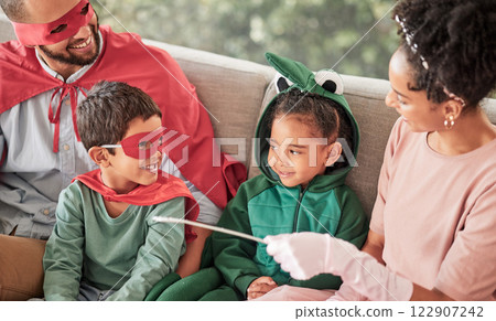 Happy family, halloween and bonding on a sofa with children looking happy and excited in their costume. Love, creativity and fun parents playing with their kids in a living room, relax and playful 122907242