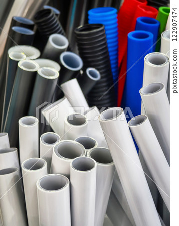 Colorful assortment of plastic tubes arranged neatly at a hardware store in the afternoon Colorful assortment of plastic tubes arranged neatly at a hardware store in the afternoon 122907474