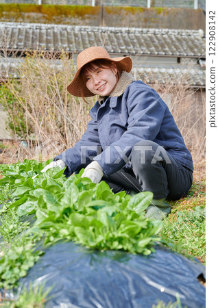 Woman working in the fields, country life, home garden Woman working in the fields, country life, home garden 122908142