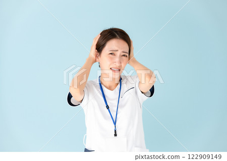 Woman, white coat, nurse, medical, holding head Woman, white coat, nurse, medical, holding head 122909149
