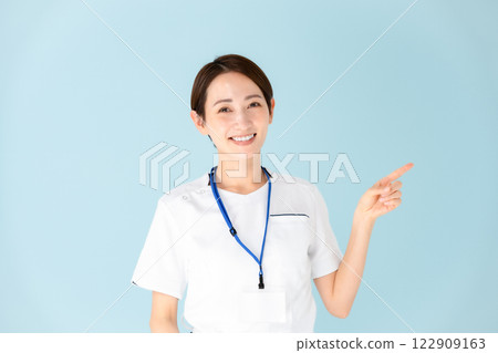 Female, white coat, nurse, medical, pointing 122909163