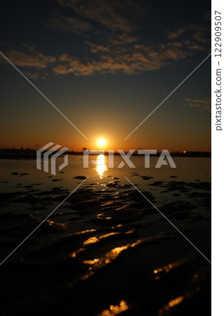 Sunset over the sea 122909507