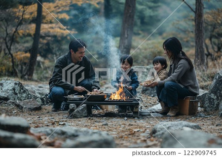 Family eating at a campsite Family eating at a campsite 122909745