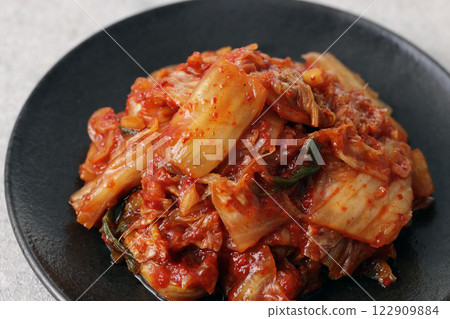 Korean spicy cabbage kimchi on a plate 122909884
