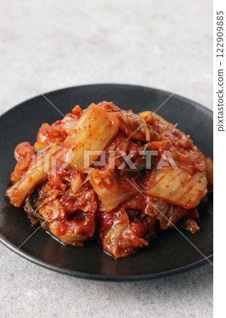 Korean spicy cabbage kimchi on a plate Korean spicy cabbage kimchi on a plate 122909885