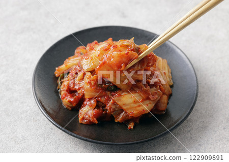 Korean spicy cabbage kimchi on a plate 122909891