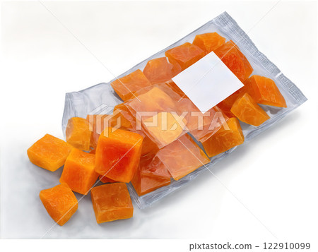Dried Mango Chunks (Mangifera indica) Dried mango chunks inside clear plastic packaging. The deep orange color and rough texture of 122910099
