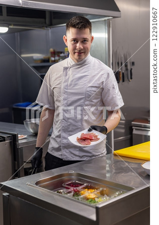 Chef in professional restaurant kitchen Chef in professional restaurant kitchen 122910667
