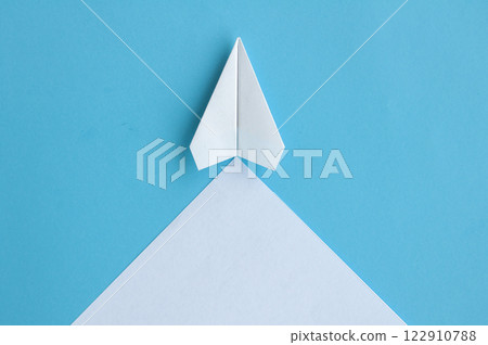 Top view of white paper airplane with customizable space for text Top view of white paper airplane with customizable space for text 122910788