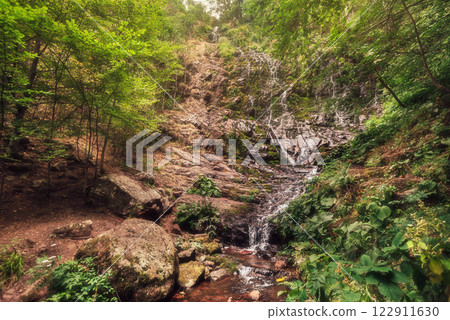 Pilj Waterfall Falling from Rocks in Mountain Forest Pilj Waterfall Falling from Rocks in Mountain Forest 122911630
