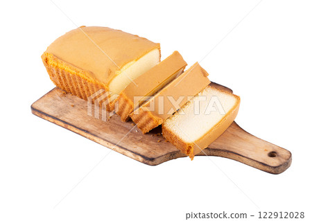 Sliced moist butter cake isolated on white background. 122912028