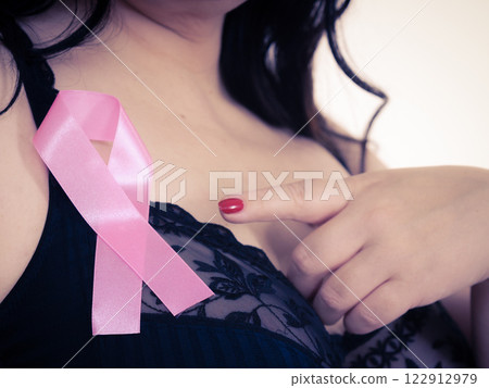 Woman chest in bra, pink cancer ribbon Woman chest in bra, pink cancer ribbon 122912979