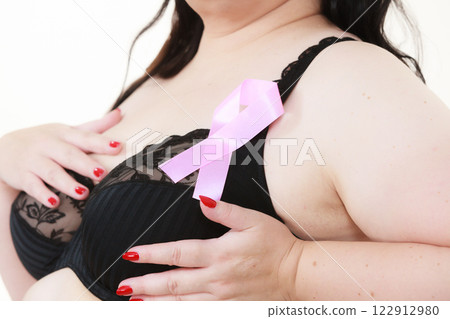 Woman chest in bra, pink cancer ribbon 122912980