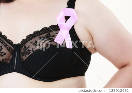 Woman chest in bra, pink cancer ribbon Woman chest in bra, pink cancer ribbon 122912981