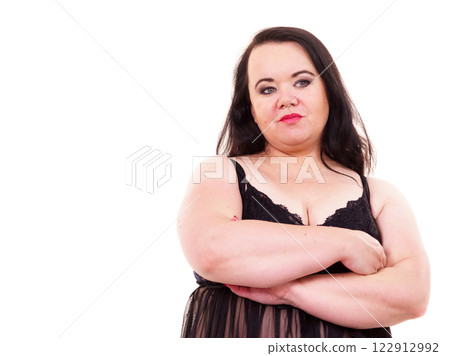 Big woman in underwear with arms folded 122912992