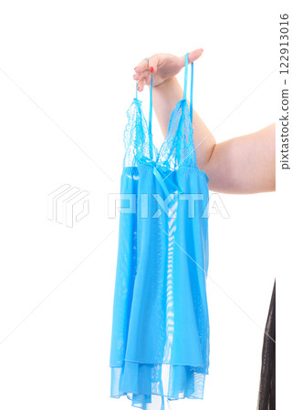 Woman holds blue babydoll Woman holds blue babydoll 122913016