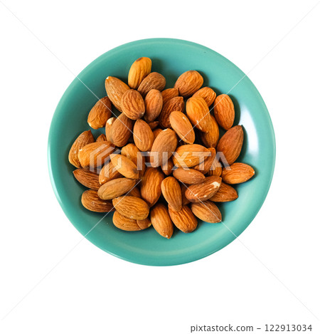 Brown almond nut seeds on a white background. 122913034
