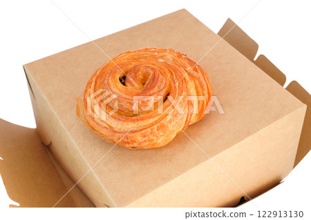 freshly baked cinnamon roll on white background. 122913130