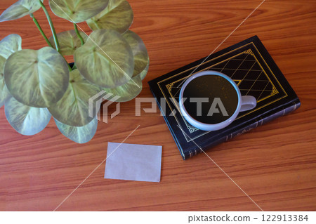 Still life,Old books with coffee cup and shot note on wood table. Still life,Old books with coffee cup and shot note on wood table. 122913384