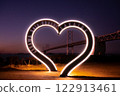 Arch-shaped monument celebrating the 35th anniversary of the opening of the Setouchi Ohashi Memorial Park Heart-shaped LED lighting Night view 122913461