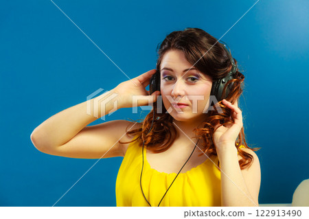 girl in big headphones listening music mp3 relaxing girl in big headphones listening music mp3 relaxing 122913490