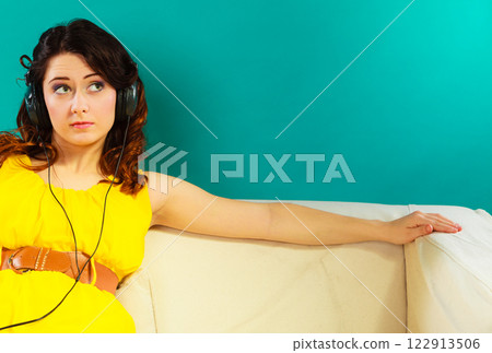 girl in headphones listening music mp3 relaxing 122913506