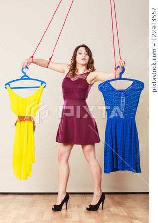 Addicted to shopping woman girl marionette with clothes 122913552