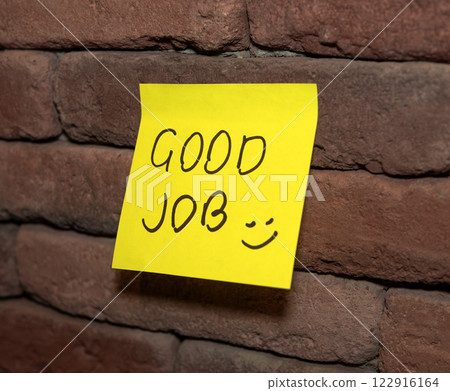 Bright yellow note encourages positivity on brick wall Bright yellow note encourages positivity on brick wall 122916164