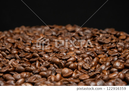 Decaffeinated coffee beans roasted close up 122916359