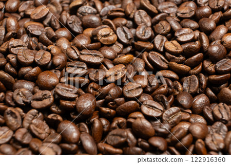 Scattered coffee beans top down macro shot Scattered coffee beans top down macro shot 122916360