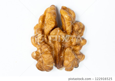 Macro peeled walnut, kernel, white isolate background, top view. 122916525