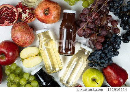 Different types of vinegar balsamic, apple, wine and pomegranate in glass bottles Different types of vinegar balsamic, apple, wine and pomegranate in glass bottles 122916534