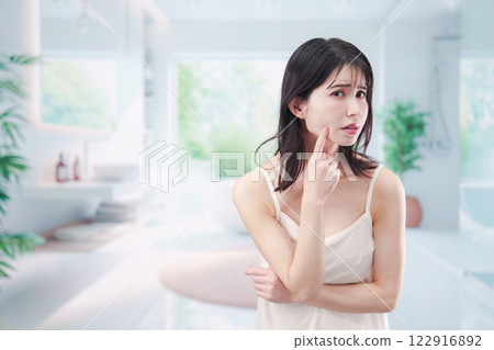Young woman suffering from skin problems 122916892