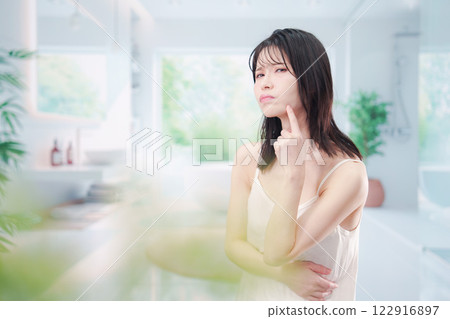 Young woman suffering from skin problems Young woman suffering from skin problems 122916897