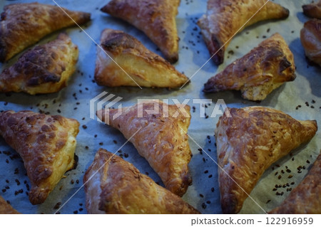 Freshly Baked Golden Brown Triangular Cake Freshly Baked Golden Brown Triangular Cake 122916959