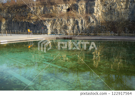 Swimming pool with dirty green water close-up. Swimming pool with dirty green water close-up. 122917564